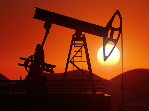 3d rendering of working oil pumping jack silhouette against the sunset
