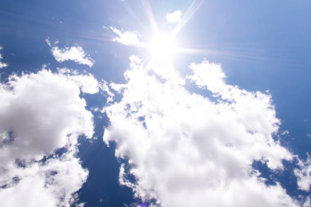 Bright sun and blue sky with clouds. Concept of abnormal heat