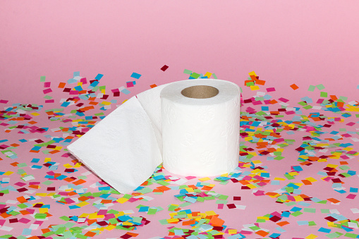toilet paper on colorful pink background, creative art design