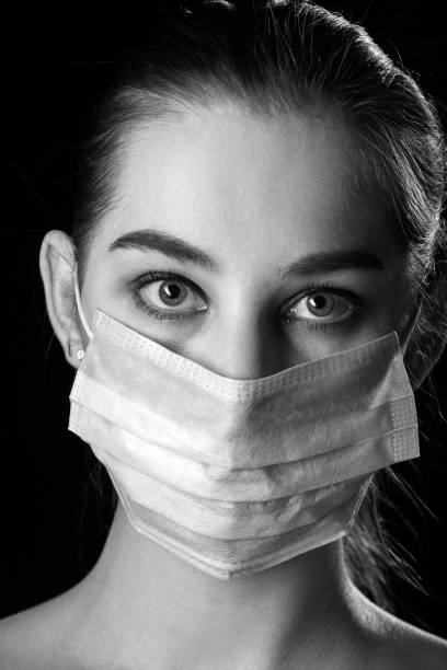istock woman in mask 1409686115