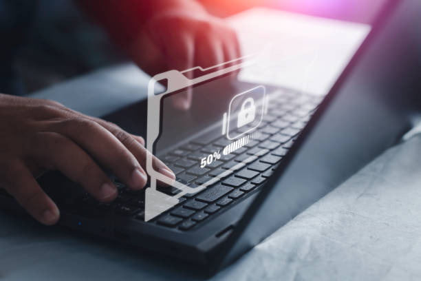 istock Businessman using laptop computer protecting business and financial data with virtual graphic data.Innovation technology 1409688088