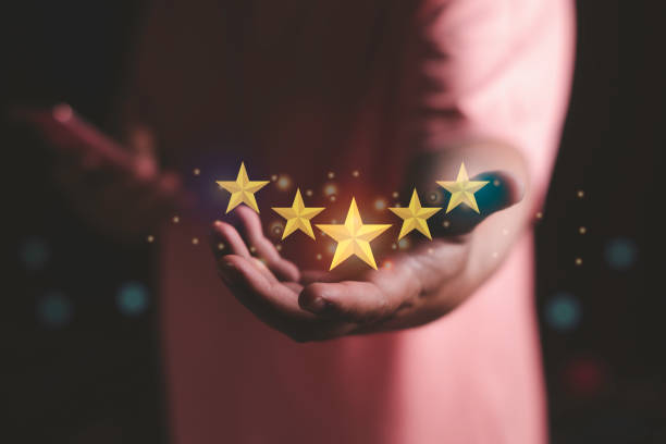 istock Hand holding the stars to five stars Customer or client satisfaction concept 1409688113