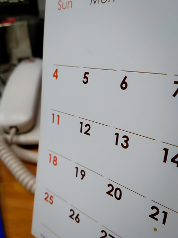 the numbers on the calendar with a slightly blurry background, deadline