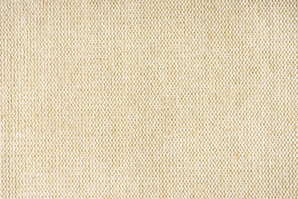 istock Close up texture of beige coarse weave upholstery fabric. Decorative textile background 1409690164