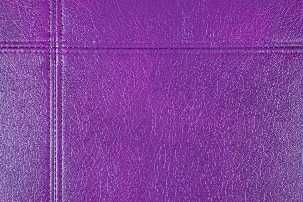 istock Purple leather, leatherette texture background wtih decorative stich 1409690166