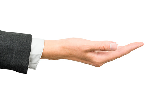 female hand in a business suit stretches out a palm, isolated on a white background