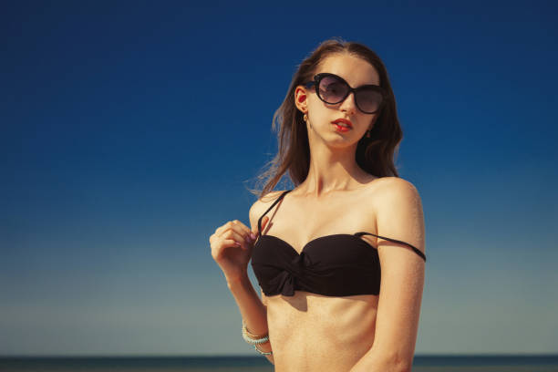 istock beautiful girl tanning 1409692652