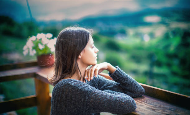 istock Disappointed lonely woman heals herself with nature. 1409698940