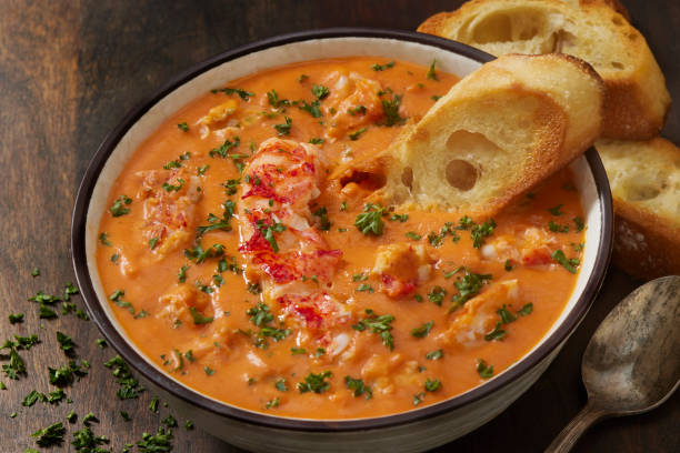 Lobster Bisque Lobster Bisque with Toasted Baguette Slices Chowder stock pictures, royalty-free photos & images