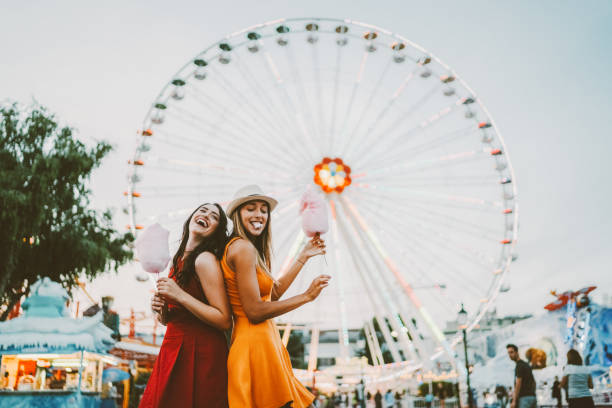istock Happy women at the amusement park 1409705862