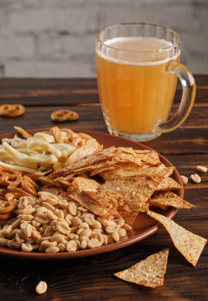 istock Assorted beer appetizer in a plate on a wooden table 1409705965