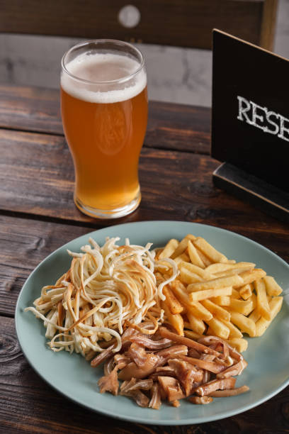 istock Assorted beer appetizer in a plate on a wooden table 1409706062