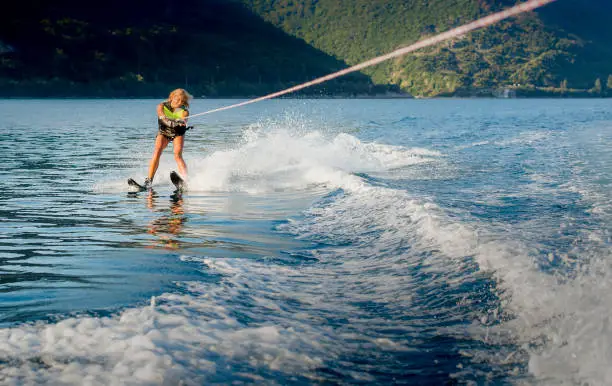 a young woman water skiing on a sea