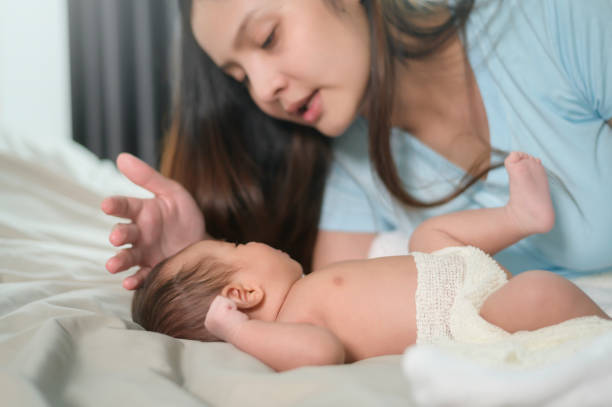 istock Young mother with a Cute new born baby. 1409710108