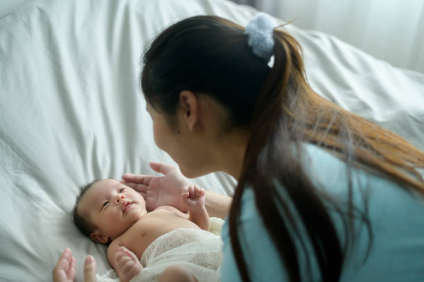 istock Young mother with a Cute new born baby. 1409710131