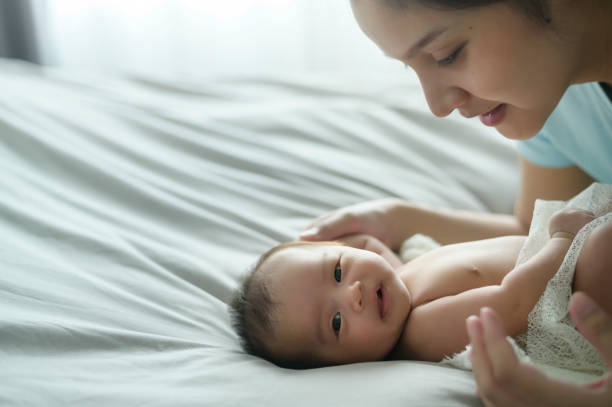 istock Young mother with a Cute new born baby. 1409710141