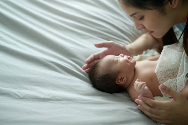 istock Young mother with a Cute new born baby. 1409710143