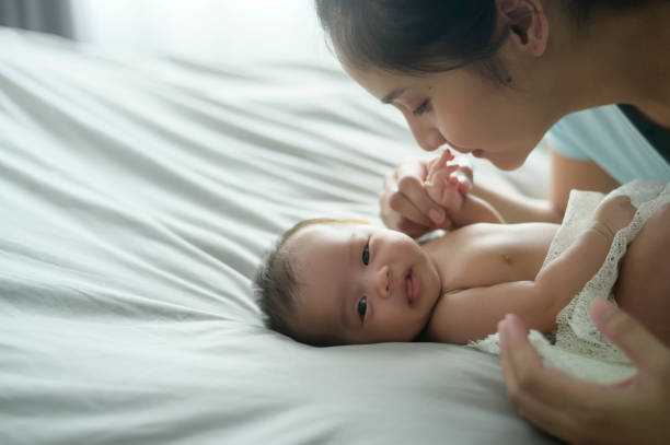 istock Young mother with a Cute new born baby. 1409710145