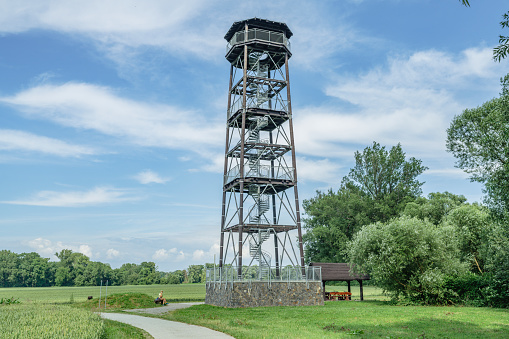 A woman resting near the observation tower on the border of the Polish-Czech meanders of the Oder in Chałupki / Zabełków.
