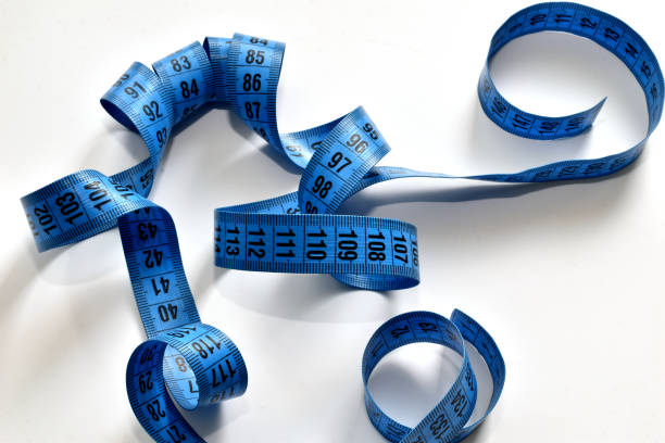 istock Blue meter of a seamstress lies on a white background. 1409714823