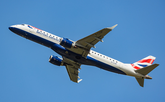 A BA CityFlyer Embraer 190SR takes off from Zurich Airport. BA CityFlyer is a subsidiary of British Airways. Registration G-LCAF. (Zurich, Switzerland, 06/26/2022)