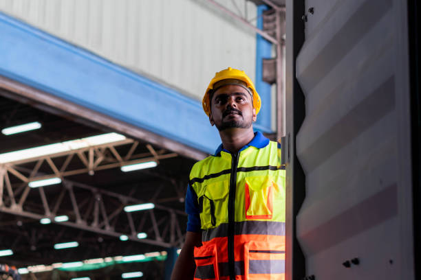istock Warehouse worker working and opening the door of containers checking goods in container box, Manual worker in factory warehouse 1409715112