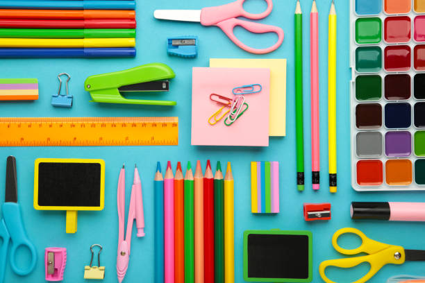 istock School supplies on blue background. Back to school concept. 1409719093
