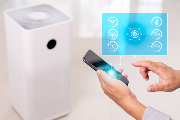istock Smart home Ai technology on icon virtual screen concept,Man use smartphone control purifier online on application adjust and setting for smart home through the internet 1409722622