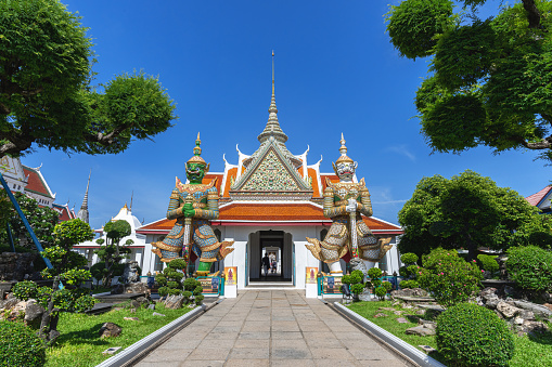 Bangkok, Thailand - September 11, 2019: tourists visiting the Wat Arun or Wat Chaeng temple, is situated on the west bank of the Chao Phraya River. Wat Arun or temple of the dawn is partly made up of colourfully decorated spires and stands majestically over the water.