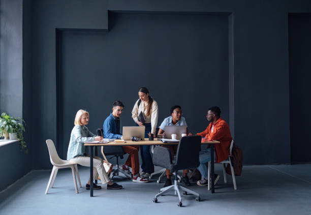 istock Five Friends Studying Together In The Library 1409723962