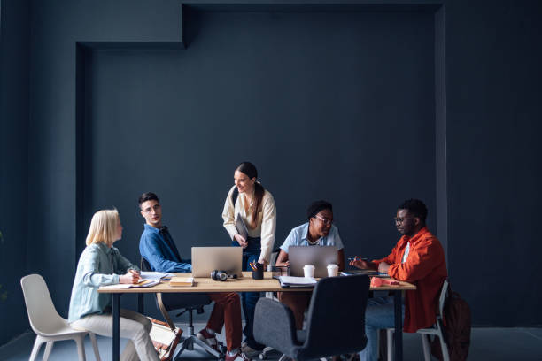 istock Five Friends Studying Together In The Library 1409723963