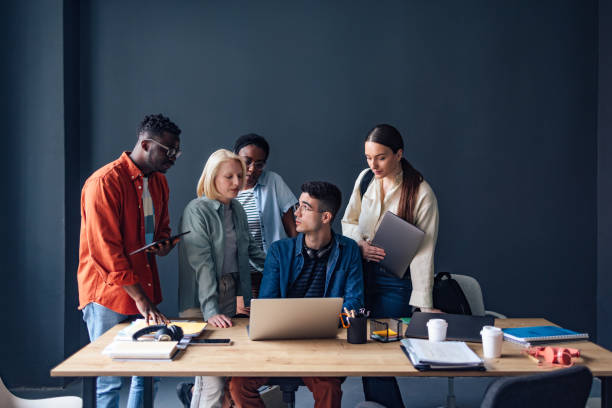 istock Five Friends Studying Together In The Library 1409723966