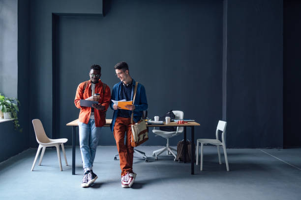 istock Two Happy Friends Studying Together In The Library 1409723986