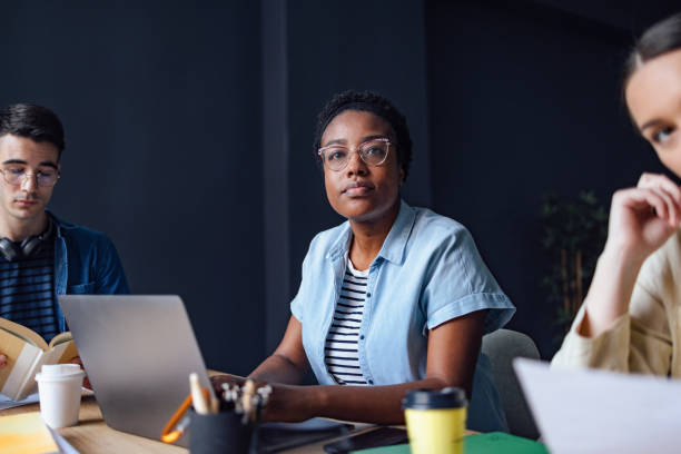 istock University Students Studying Together In The Library 1409724017