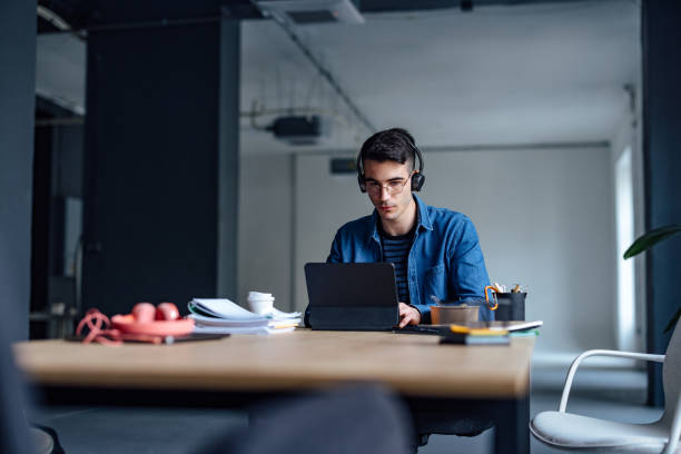 istock University Student Studying Online On His Digital Tablet In The Library 1409724047