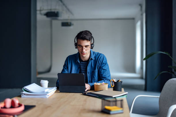 istock University Student Studying Online On His Digital Tablet In The Library 1409724048