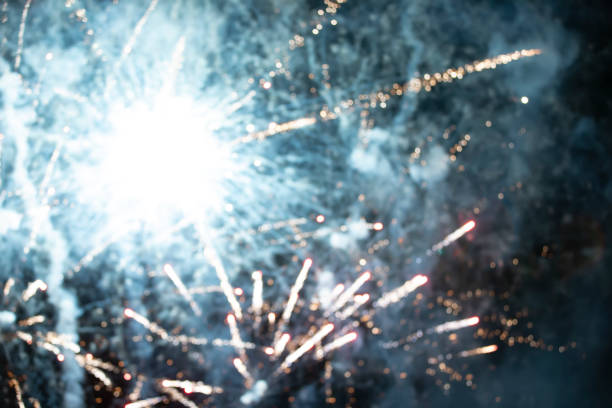 istock On a black background bokeh from explosions of colorful fireworks. 1409724290
