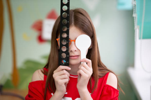 A little girl with visual impairment is being treated.