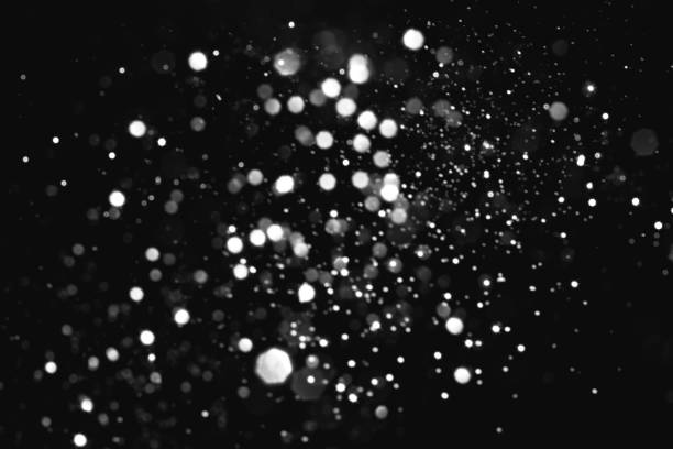 istock White gray blurred bokeh lights on black background 1409726934