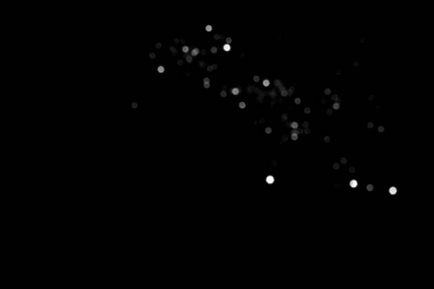 istock White gray blurred bokeh lights on black background 1409726995