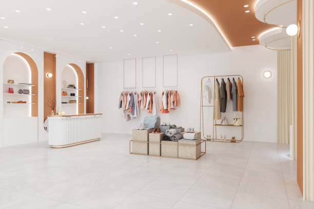 Luxury Clothing Store Interior With Clothes, Shoes And Personal Accessories stock photo