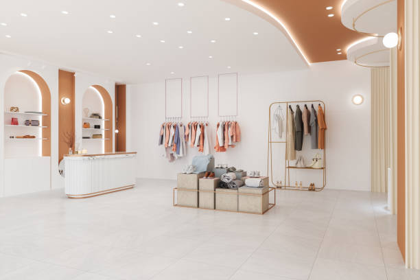 Luxury Clothing Store Interior With Clothes, Shoes And Personal Accessories Luxury Clothing Store Interior With Clothes, Shoes And Personal Accessories showroom stock pictures, royalty-free photos & images