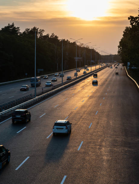 istock Traffic on highway at sunset, motion blur 1409729278