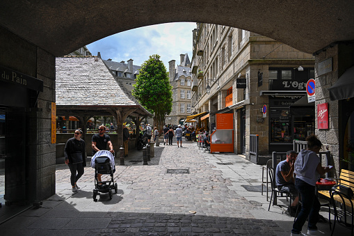 Saint-Malo, France, June 27, 2022 - Tourists at the Place du Marché aux legumes of the old town of Saint-Malo Intra Muros