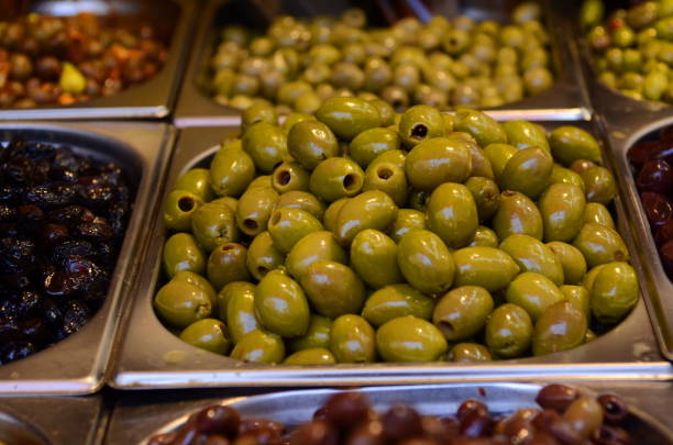 istock Appetizing marinated olives in stall market 1409729797
