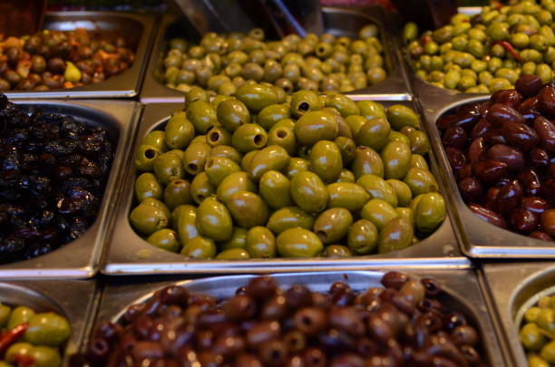 istock Appetizing marinated olives in stall market 1409729820