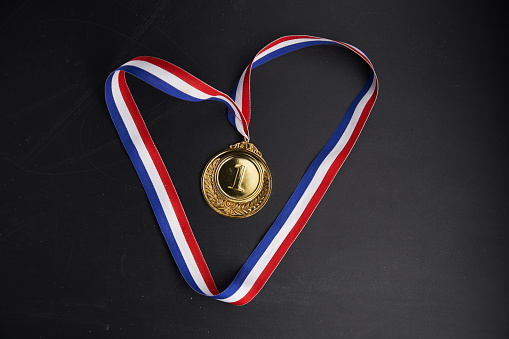 number one medal against chalkboard