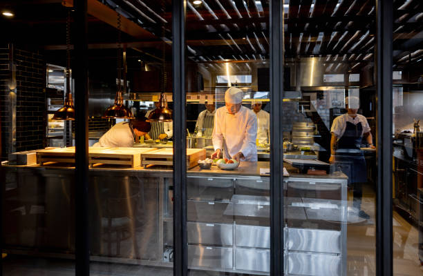 istock Group of chefs working in a commercial kitchen at a restaurant 1409730021