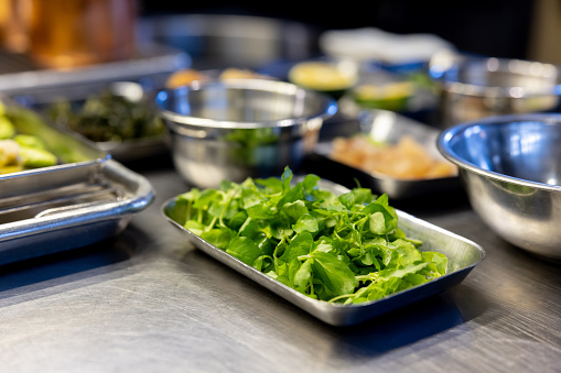 Close-up on some ingredients in a commercial kitchen at a restaurant - preparing food concepts
