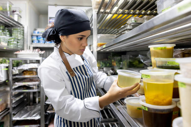 istock Chef looking for some ingredients in the pantry at a commercial kitchen 1409730663